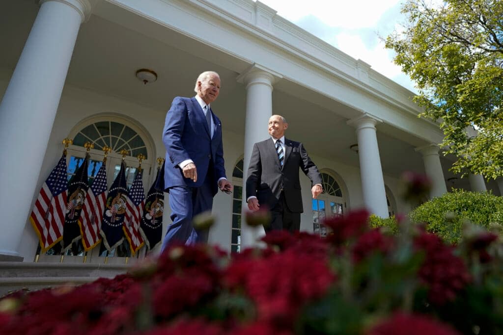 President Joe Biden, left, and Bob Parant, a Medicare beneficiary, walk out to speak in the Rose Garden of the White House in Washington, Tuesday, Sept. 27, 2022, during an event on health care costs. (AP Photo/Susan Walsh)