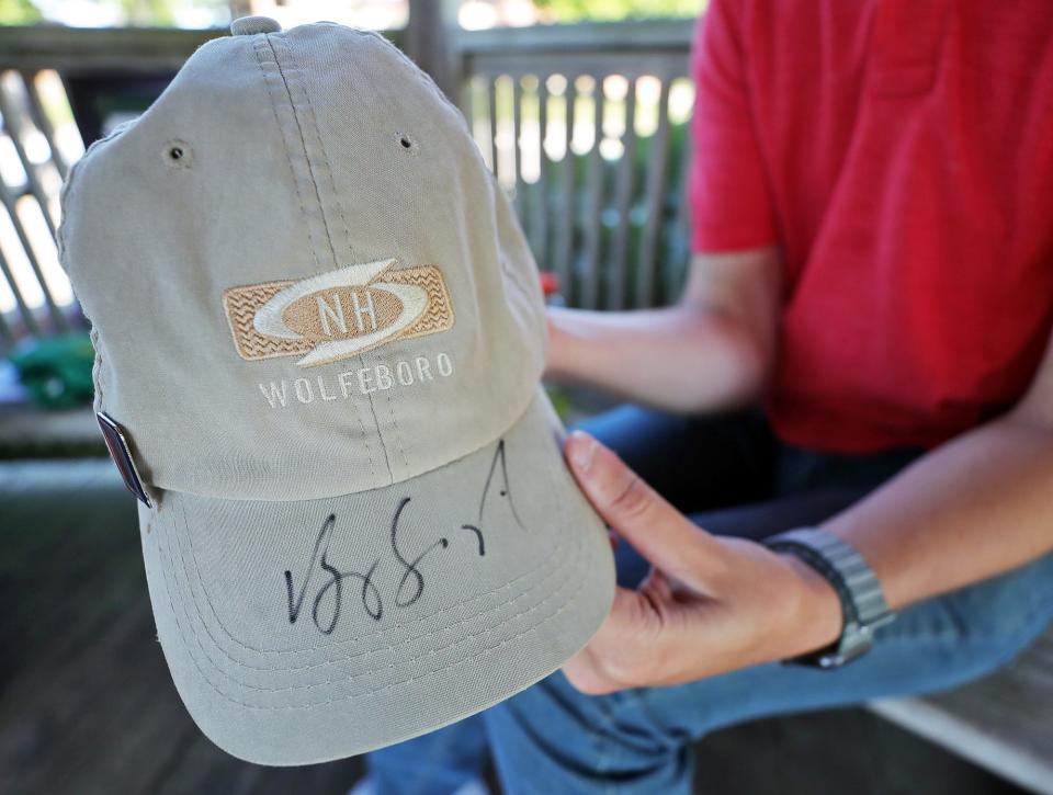 Jeremy Gaia shows off the autograph he received from Vijay Singh  at Firestone Country Club on Tuesday.