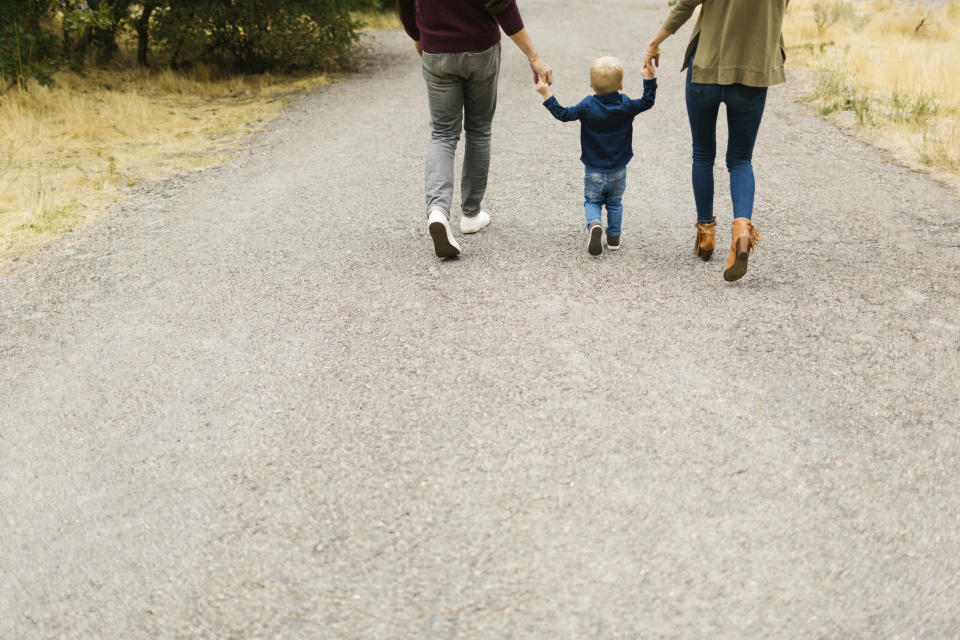 Family walking on rural road together