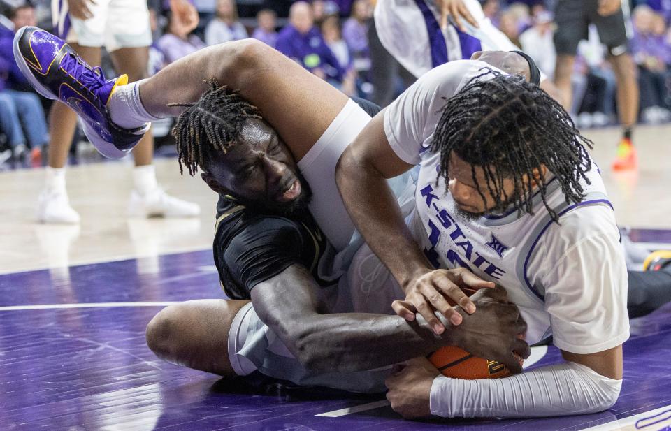 Kansas State center Will McNair (13) and Central Florida's Ibrahima Diallo scramble for a loose ball in the first half Saturday at Bramlage Coliseum.