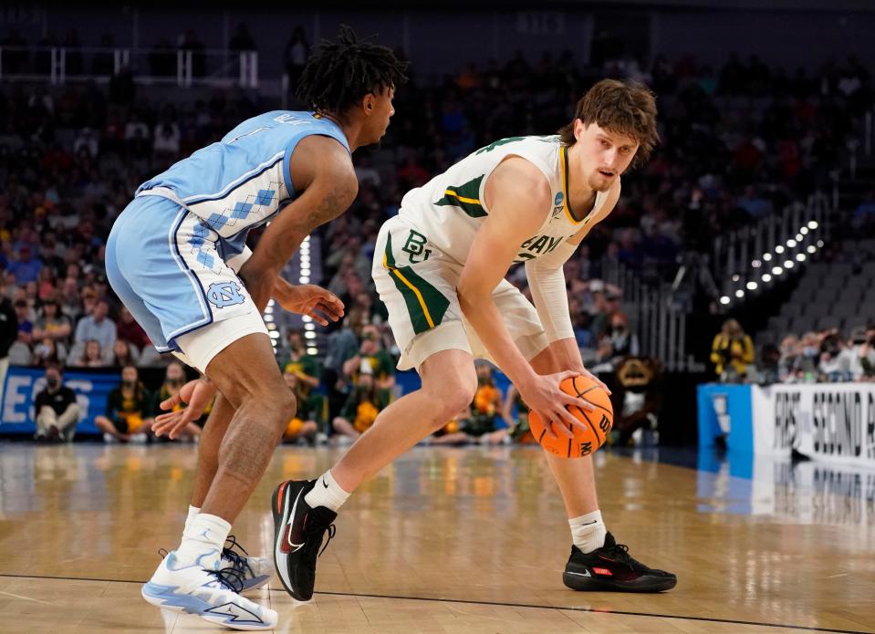 Baylor’s Matthew Mayer, right, looks to make a move on North Carolina’s Leaky Black in the second round of the NCAA Tournament at Dickies Arena in Fort Worth, Texas.