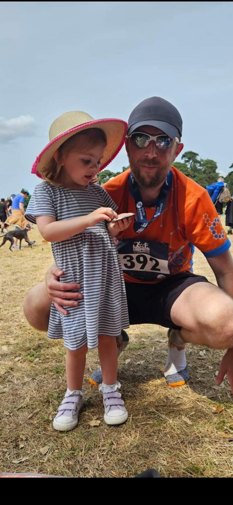 Teacher Ryan Thomas with his daughter (Handout/PA)