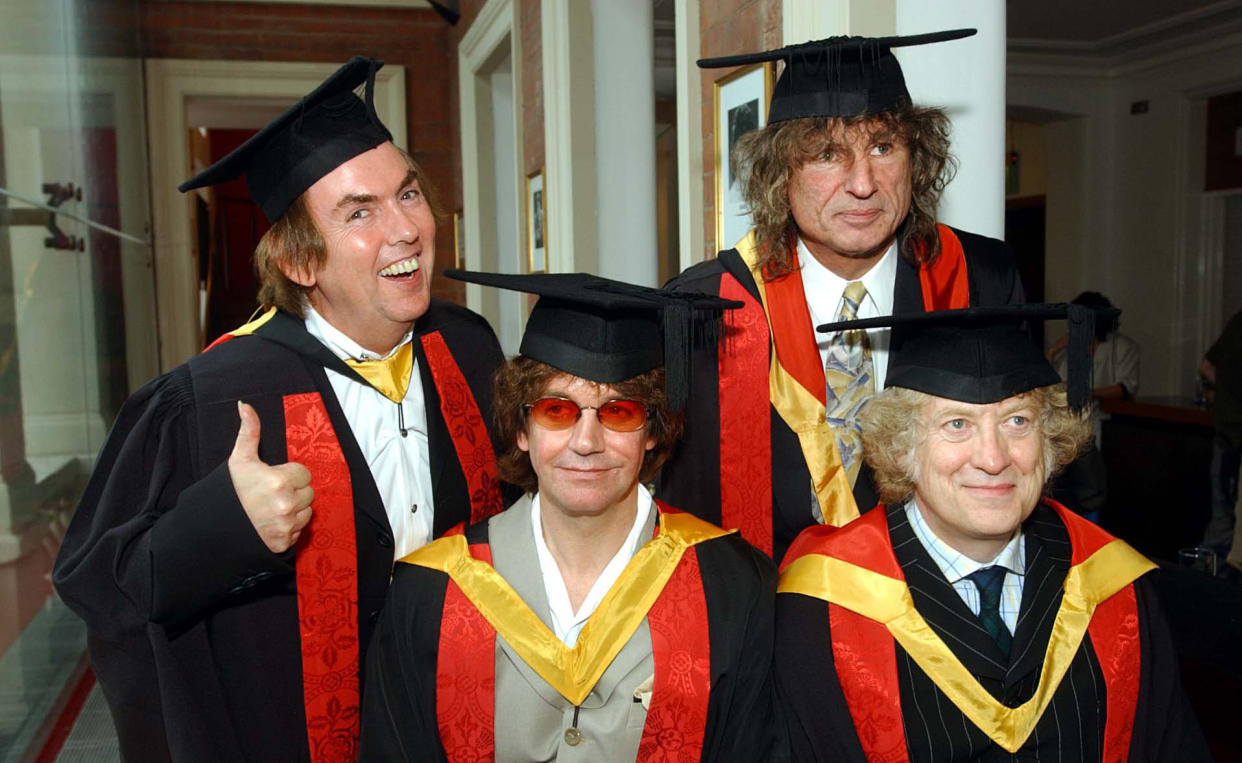 Former members of the band 'Slade' (from left) - Noddy Holder, Dave Hill, Jim Lea and Don Powell, collect their honorary followships from their home town University of Wolverhampton.   *  The band who recorded 17 consecutive top 20 hits between 1971 and 1976 were being honored in recognition of their contribution to the music industry. 