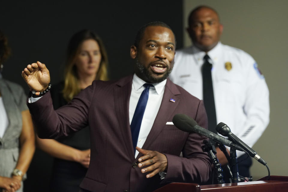 Richmond Mayor Levar Stoney, left, gestures while Police Chief Gerald M Smith, right, listens during a press conference at Richmond Virginia Police headquarters, Wednesday, July 6, 2022, in Richmond, Va. Police said Wednesday that they thwarted a planned July 4 mass shooting after receiving a tip that led to arrests and the seizure of multiple guns — an announcement that came just two days after a deadly mass shooting on the holiday in a Chicago suburb. (AP Photo/Steve Helber)