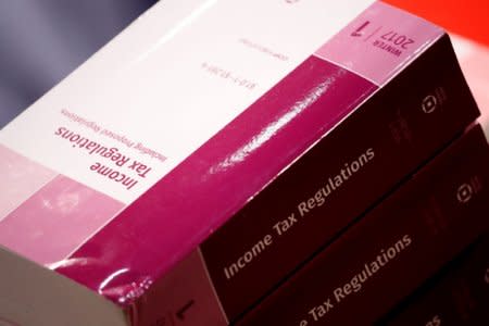 Copies of tax legislation are seen during a markup on the