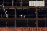 Construction workers are seen working on the base of the 30 Hudson Yards building, Wells Fargo & Co.'s future offices on Manhattan's west side in New York March 22, 2016. REUTERS/Brendan McDermid