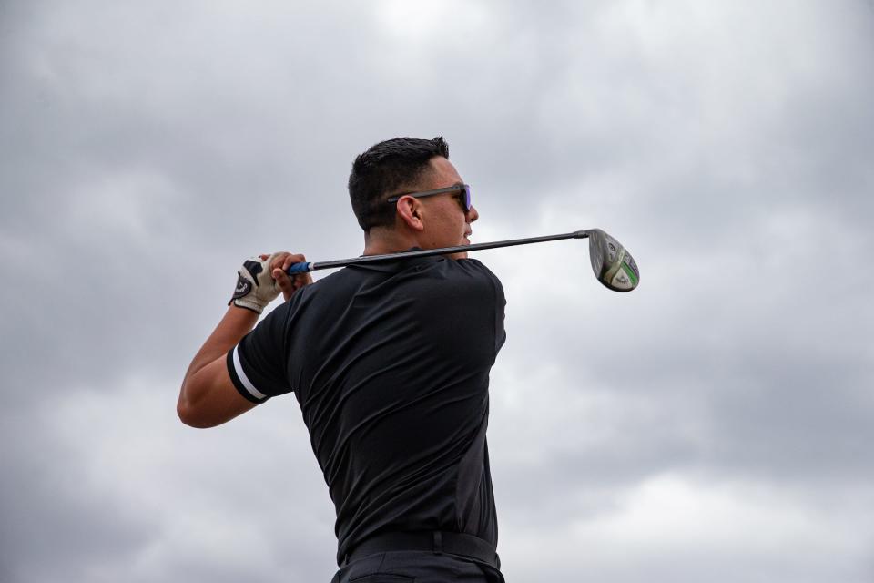 Santa Gertrudis Academy senior Sebastian Read, 18, practices at the driving range at L E Ramey Golf Course in Kingsville, Texas, on May 5, 2022. 