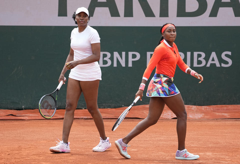 Venus Williams, left with doubles partner Coco Gauff of the United States prepare to play against EllenPerez of Australia and Saisai Zheng of China in a first round women's doubles match day four of the French Open tennis tournament at Roland Garros in Paris, France, Wednesday, June 2, 2021. (AP Photo/Michel Euler)