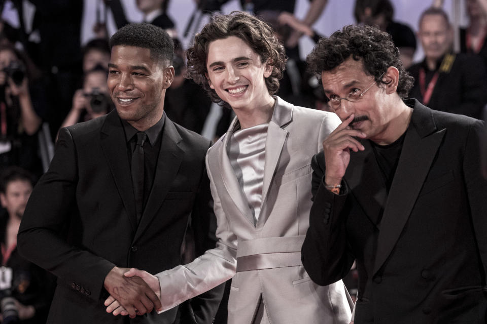 Kid Cudi and Timothée Chalamet shaking hands