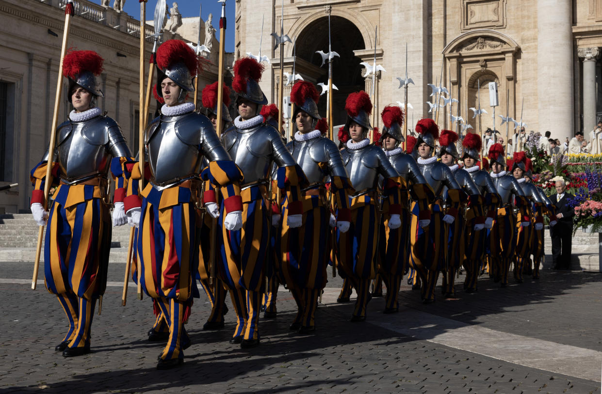 VATICAN CITY, VATICAN - APRIL 09: Pontifical Swiss Guards patrol St. Peter's Square as Pope Francis leads the Easter Mass, on April 09, 2023 in Vatican City, Vatican. Over 45,000 pilgrims filled a sunny St. Peter’s Square on Easter Sunday morning. (Photo by Alessandra Benedetti - Corbis/Corbis via Getty Images)