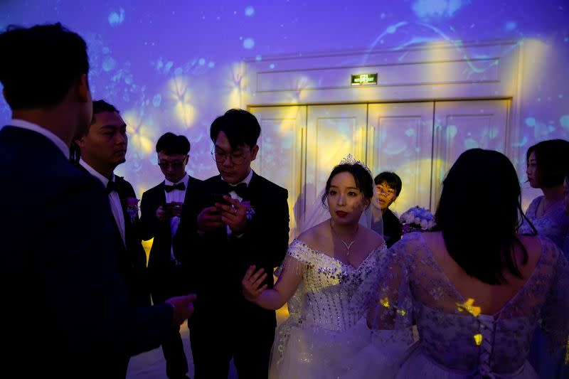 The Wider Image: Coronavirus dampens celebrations in China's wedding gown city