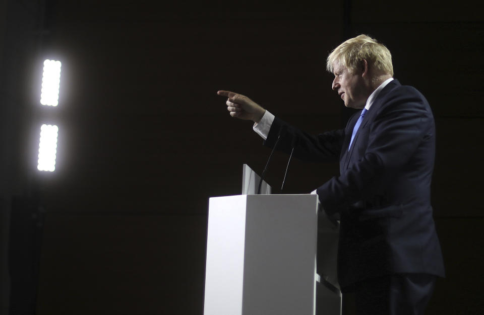 Britain's Prime Minister Boris Johnson gestures as he speaks during a press conference on the third and final day of the G-7 summit in Biarritz, France Monday, Aug. 26, 2019. (AP Photo/Markus Schreiber)