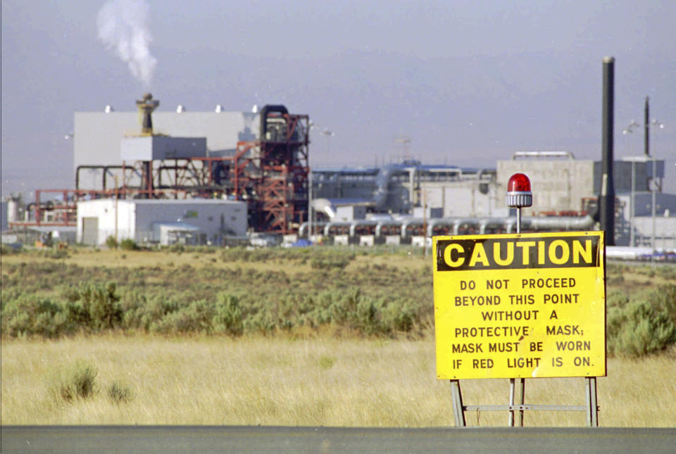 FILE - In this photo provided by the U.S. Army, steam from the pollution abatement system rises from a smokestack at the Army's disposal plant as a rocket is destroyed at the nation's first chemical weapons incinerator Thursday, Aug. 22, 1996, in Tooele, Utah. (Diana Ricketts/U.S. Army via AP, File)