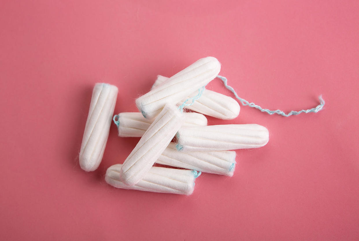 tampons on a pink background. (PhotoMiMiMi / Getty Images)