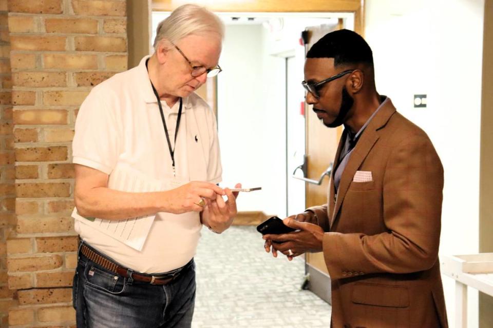 Pastor Bob Farrow of St. Nicholas Episcopal in Hamilton, Georgia and Pastor Willie J. Barber II of Prospect A.M.E. meet and share contact information at the Green Team Summit.