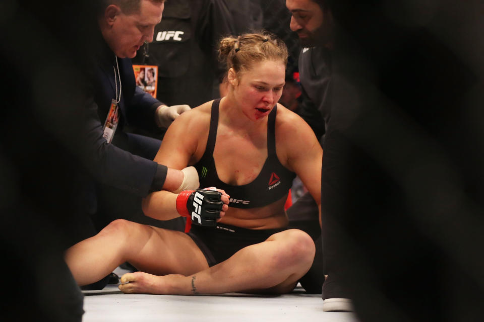 MELBOURNE, AUSTRALIA - NOVEMBER 15:  Ronda Rousey of the United States receives medical treatment after being defeated by Holly Holm of the United States in their UFC women's bantamweight championship bout during the UFC 193 event at Etihad Stadium on November 15, 2015 in Melbourne, Australia.  (Photo by Quinn Rooney/Getty Images)