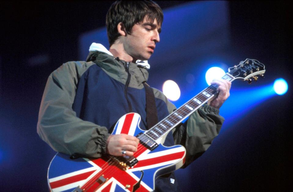 Noel Gallagher of Oasis performing at Maine Road in Manchester in 1996 (Redferns)