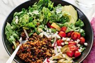 Improvise your taco salad, starting with this cumin-tinged quinoa and black bean recipe. Bolster the beans with fresh greens tossed in a zippy avocado-lime dressing and crunchy radishes or red onion. <a href="https://www.epicurious.com/recipes/food/views/fresh-taco-salad-with-creamy-avocado-lime-dressing?mbid=synd_yahoo_rss" rel="nofollow noopener" target="_blank" data-ylk="slk:See recipe.;elm:context_link;itc:0" class="link ">See recipe.</a>