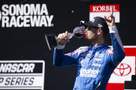 Kyle Larson celebrates his victory in a NASCAR Cup Series race, Sunday, June 6, 2021, at Sonoma Raceway in Sonoma, Calif. (AP Photo/D. Ross Cameron)