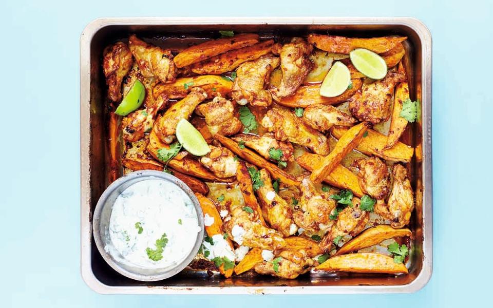 <p>David Loftus</p><p>Sticky, spicy wings plus a cool, creamy dip is a game-winning combo.</p><p><strong>Get the recipe: <a href="https://parade.com/653399/parade/spicy-chipotle-chicken-wings-with-sweet-potato-wedges-cilantro-lime-yogurt/" rel="nofollow noopener" target="_blank" data-ylk="slk:Spicy Chipotle Chicken Wings with Sweet Potato Wedges;elm:context_link;itc:0;sec:content-canvas" class="link ">Spicy Chipotle Chicken Wings with Sweet Potato Wedges</a></strong></p>