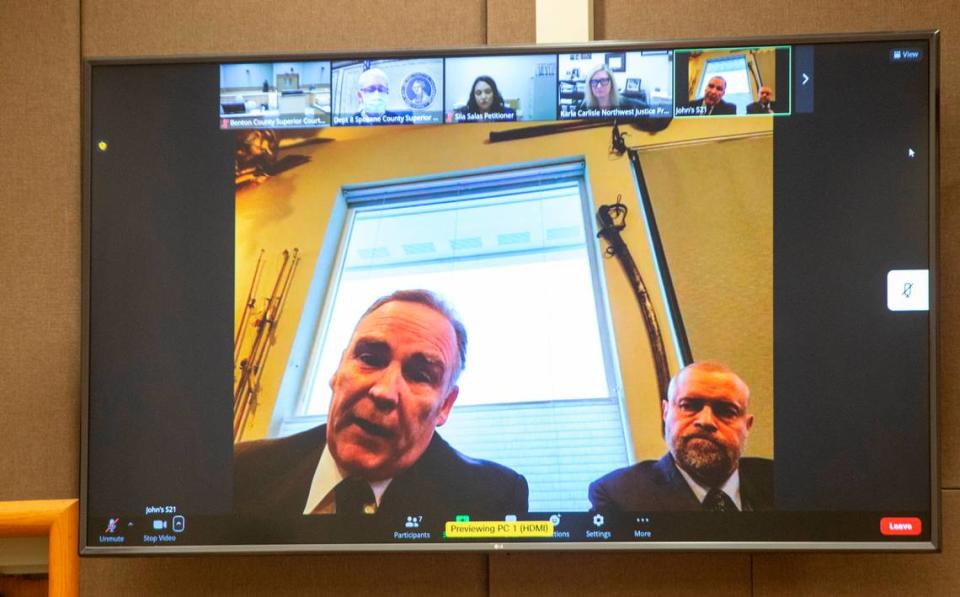 Judge Sam Swanberg with Benton-Franklin Superior Court, right, appeared for a virtual hearing with attorney John Jensen. Swanberg agreed to a modified no-contact order that allows him to preside over cases at the Benton County Justice Center, where his ex-girlfriend also works.