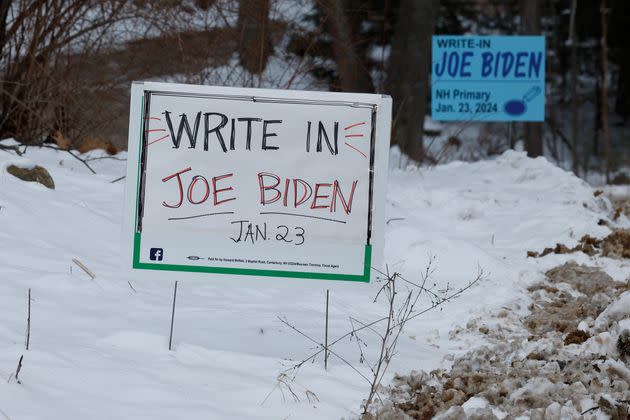 Campaign signs asking voters to write in President Joe Biden in next Tuesday's primary election stand along the road in Loudon, New Hampshire, on Jan. 19. 