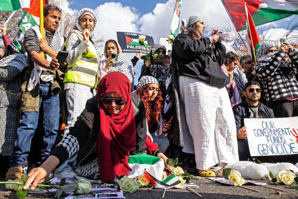 Supporters place white roses to honor the dead at the entrance to the driveway of President Biden's home during a Rally in Support of Palestine in Greenville, Saturday, Nov. 11, 2023.. According to event organizers, close to 2,000 participants attended the rally and march.