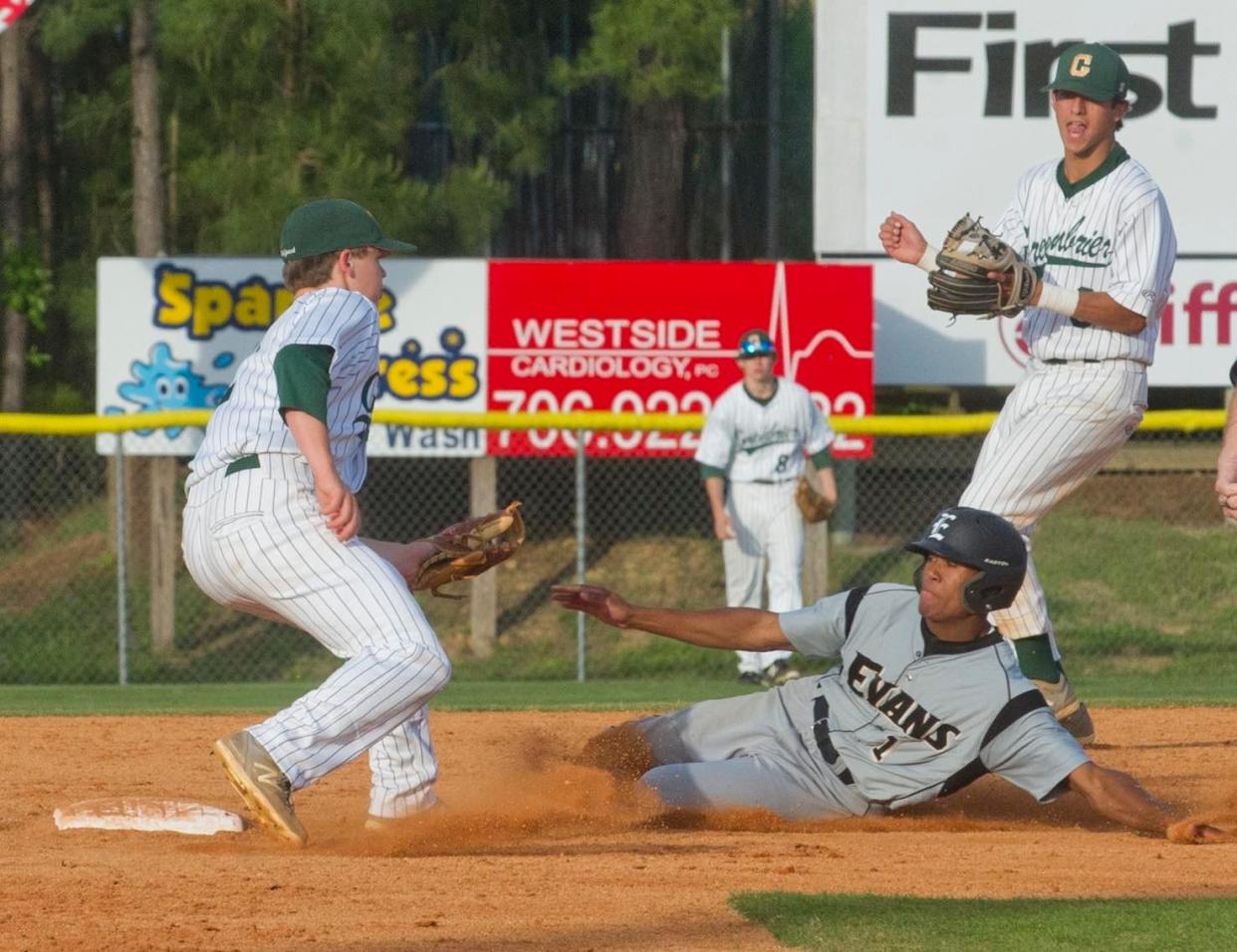 Former Evans baseball player Elliott Melton (sliding) made his debut as a professional baseball umpire in 2022. Melton was assigned to the series between the Augusta GreenJackets and Fayetteville Woodpeckers at SRP Park last week.