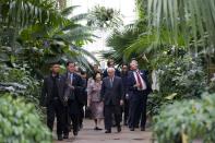 Singapore's President Tony Tan Keng Yam (C) and his wife Mary (C-L) walk through the Palm House Tropical Rainforest at Kew Gardens in West London on October 24, 2014