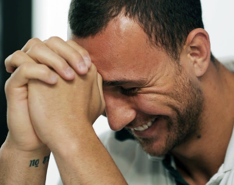 In this file photo, Quade Cooper is seen during a press conference in Auckland, during the 2011 Rugby World Cup, on October 12, 2011. Cooper's front-line defence will be under scrutiny for the Queensland Reds in this weekend's Super Rugby after his omission from the Wallabies' preliminary squad for next month's series against the British and Irish Lions
