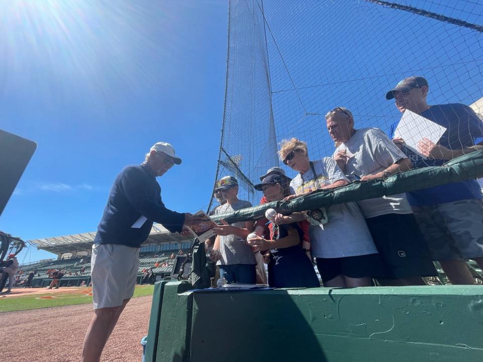 Former Tigers manager Jim Leyland signs autographs before a spring training game at Joker Marchant Stadium in February of 2024.