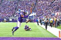 <p>Golden Tate #15 of the Detroit Lions leaps into the end zone for the go ahead touchdown while being tackled by Andrew Sendejo #34 of the Minnesota Vikings during overtime on November 6, 2016 at US Bank Stadium in Minneapolis, Minnesota. (Photo by Stacy Revere/Getty Images) </p>