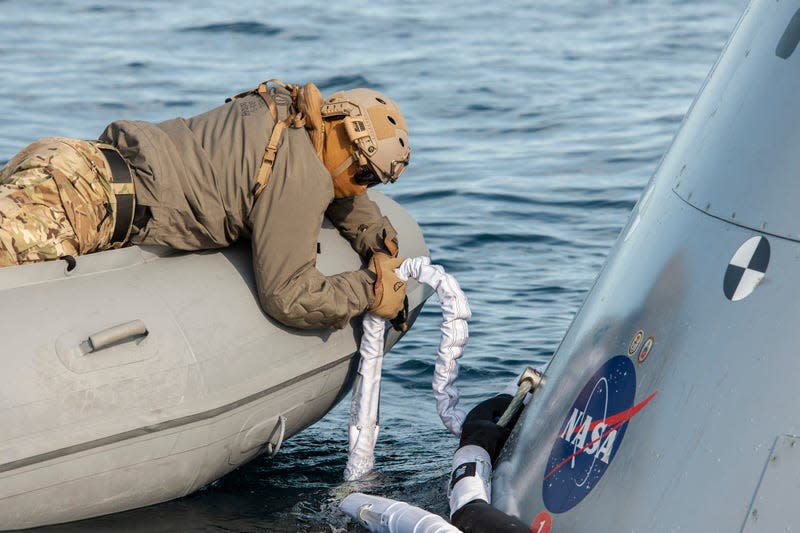 A recovery team member installing lines during a practice exercise on December 2, 2022.