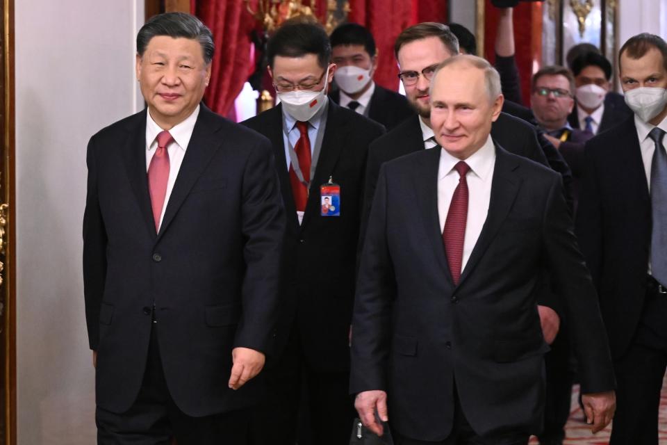 Russian President Vladimir Putin and Chinese President Xi Jinping enter a hall for their talks at The Grand Kremlin Palace in the Kremlin in Moscow, Russia, Tuesday, March 21, 2023. (Grigory Sysoyev, Sputnik, Kremlin Pool Photo via AP)