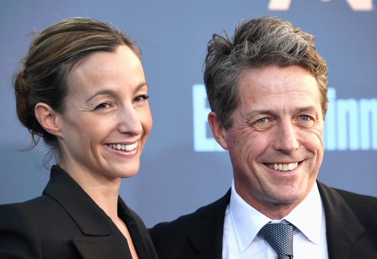 SANTA MONICA, CA - DECEMBER 11: Hugh Grant (R) and Anna Elisabet Eberstein attend The 22nd Annual Critics' Choice Awards at Barker Hangar on December 11, 2016 in Santa Monica, California. (Photo by Frazer Harrison/Getty Images)