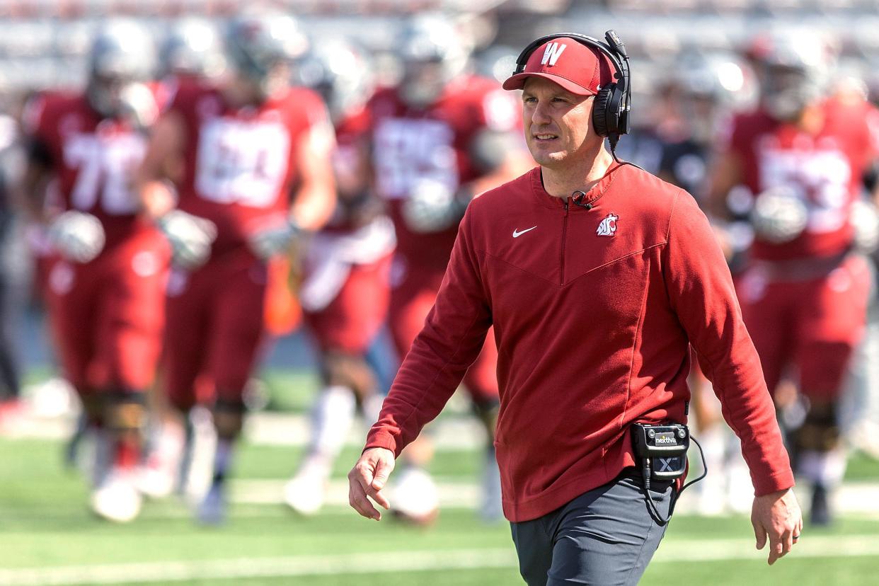 Washington State coach Jake Dickert walks across the field during the NCAA college football team's spring game Saturday, April 23, 2022, in Pullman, Wash. Dickert took over Washington State at a time of turmoil and was proven to be the right choice for the Cougars at that time.