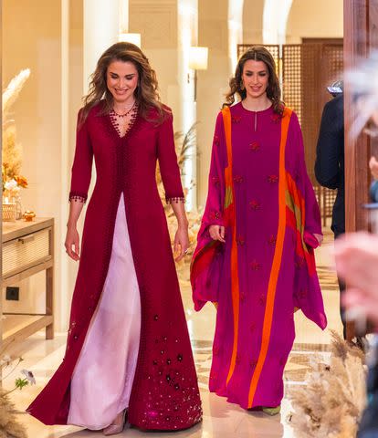 <p>The Royal Hashemite Court via Jordan Pix/Getty</p> Queen Rania and Rajwa attend Henna party in March 2023