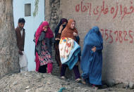 <p>Afghan women leave the site of a blast and gun fire in Jalalabad, Afghanistan, Jan. 24, 2018. (Photo: Parwiz/Reuters) </p>