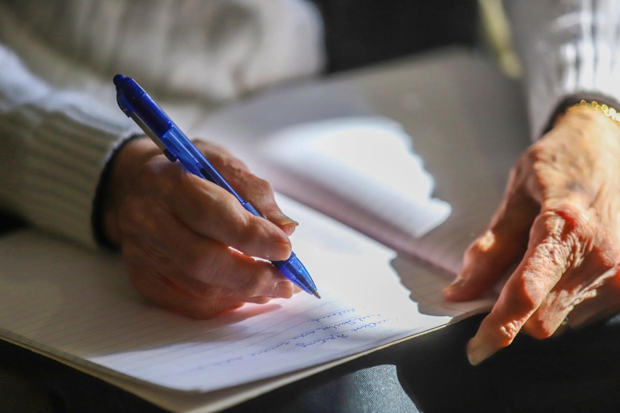 Edith Blumer, 98, a resident at Norma Jean and Edward Meer Independent Living Apartments in West Bloomfield, does her writing in cursive, first in pencil, then with a fine-point pen.