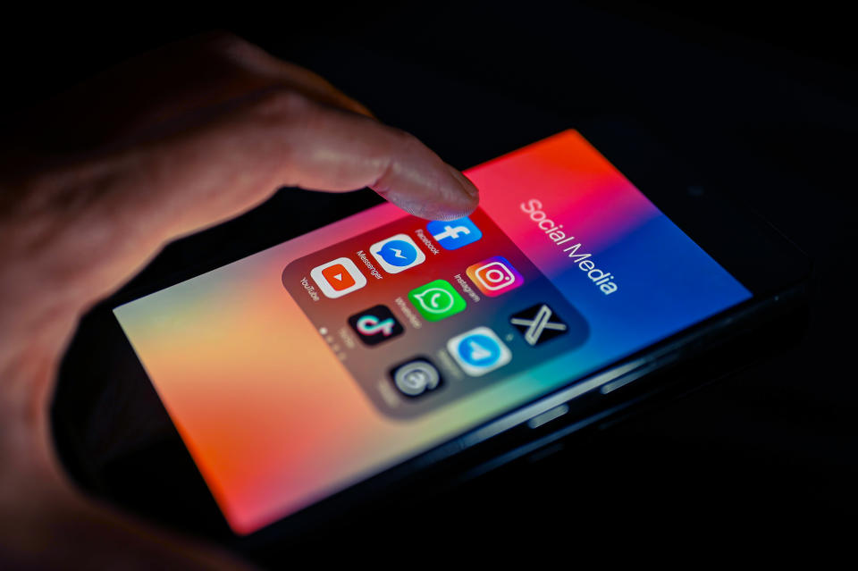 Close - up finger pointing to Facebook mobile app displayed on a smartphone screen alongside that of X,Whatsapp,Telegram,TikTok,Threads, on August 15, 2023, in Brussels, Belgium. (Photo illustration by Jonathan Raa/NurPhoto via Getty Images)