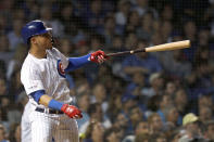 Chicago Cubs' Willson Contreras watches his home run off Cincinnati Reds relief pitcher Robert Stephenson during the seventh inning of a baseball game Wednesday, Sept. 18, 2019, in Chicago. (AP Photo/Charles Rex Arbogast)