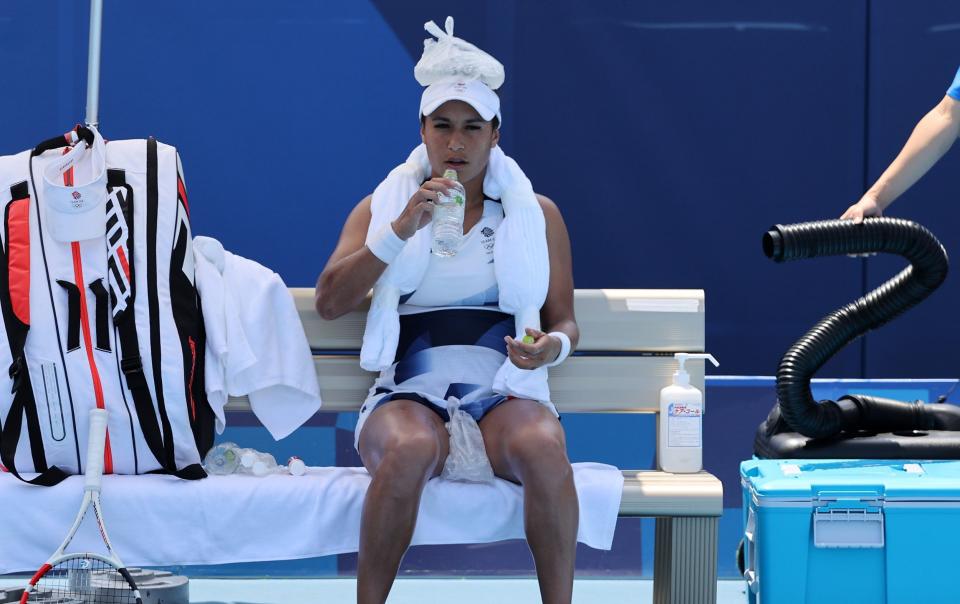 Heather Watson of Team GB attempts to keep cool by putting an ice pack on her head during the Tokyo Olympics - Getty