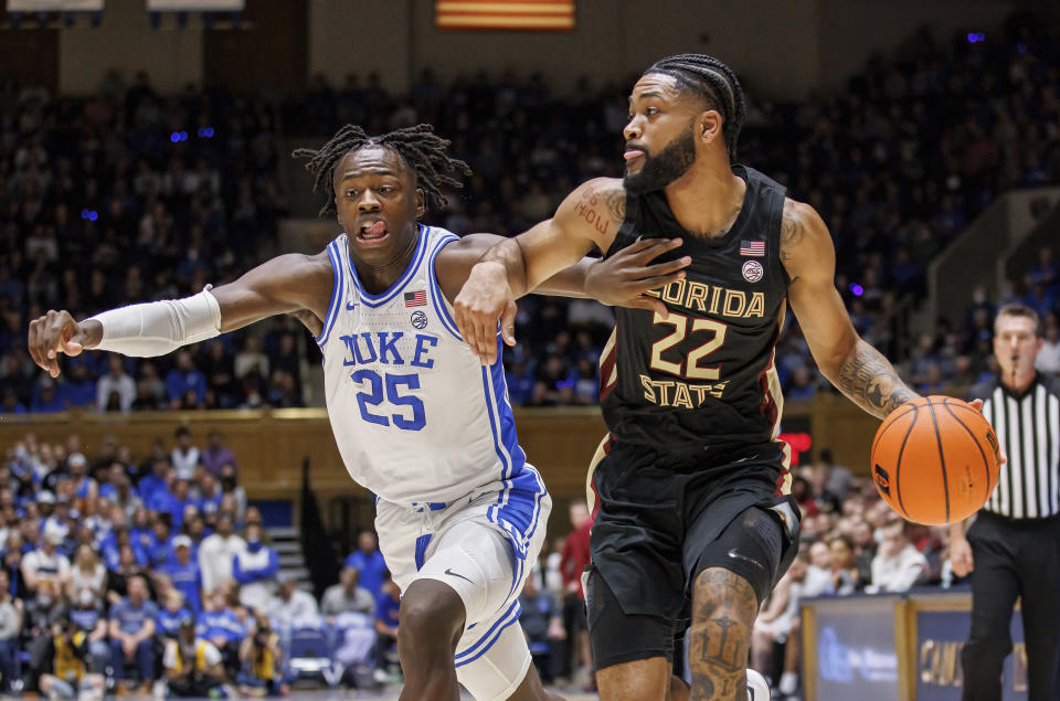 Florida State's Darin Green (22) drives against Duke's Mark Mitchell (25) during the first half of an NCAA college basketball game in Durham, N.C., Saturday, Dec. 31, 2022. (AP Photo/Ben McKeown)