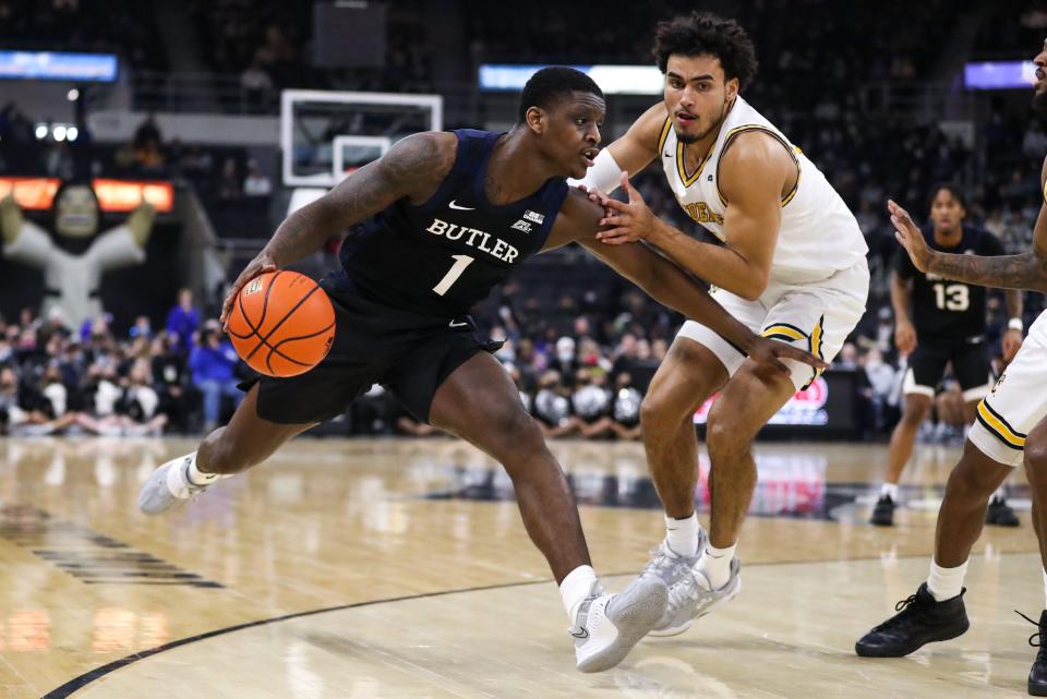 Jan 23, 2022; Providence, Rhode Island, USA; Butler Bulldogs guard Bo Hodges (1) drives to the basket while defended by Providence Friars forward Justin Minaya (15) during the first half at Dunkin' Donuts Center.