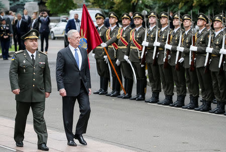 U.S. Secretary of Defense James Mattis and Ukraine's Defence Minister Stepan Poltorak walk past honour guards during a welcoming ceremony in Kiev, Ukraine August 24, 2017. REUTERS/Gleb Garanich