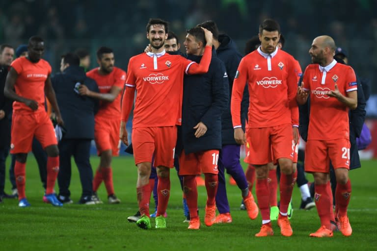 Fiorentina's players celebrate after their UEFA Europa League round of 32 first-leg match against Borussia Moenchengladbach, in Moenchengladbach, western Germany, on February 16, 2017