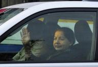 J. Jayalalithaa, former chief minister of Tamil Nadu state, waves to her supporters from a car after leaving the jail in the southern Indian city of Bangalore October 18, 2014. REUTERS/Abhishek N. Chinnappa
