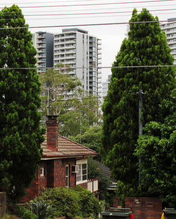 Apartment towers built by China's Poly Real Estate Group Co. are seen behind single-storey homes in the suburb of Epping, Sydney, Australia February 1, 2019. Picture taken February 1, 2019. REUTERS/Tom Westbrook