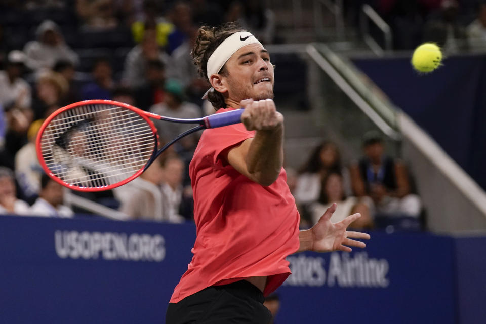 Taylor Fritz, of the United States, returns a shot to Jakub Mensik, of the Czech Republic, during the third round of the U.S. Open tennis championships, Friday, Sept. 1, 2023, in New York. (AP Photo/Charles Krupa)