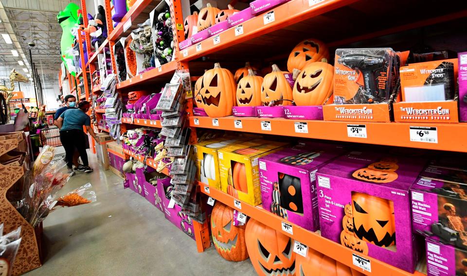 Shoppers peruse the Halloween assortment at a home improvement store in Alhambra, Calif. on Sept. 9, 2020.